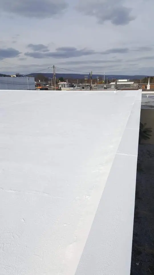 Superior spray foam insulation installation showcasing lightweight application and self-flashing properties around roof penetrations